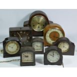A collection of clocks to include, a Metamec electric clock, a Smiths electric clock, together