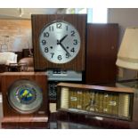 A Seiko 8 day wall clock with glazed front, together with a Seiko world time desk clock and a