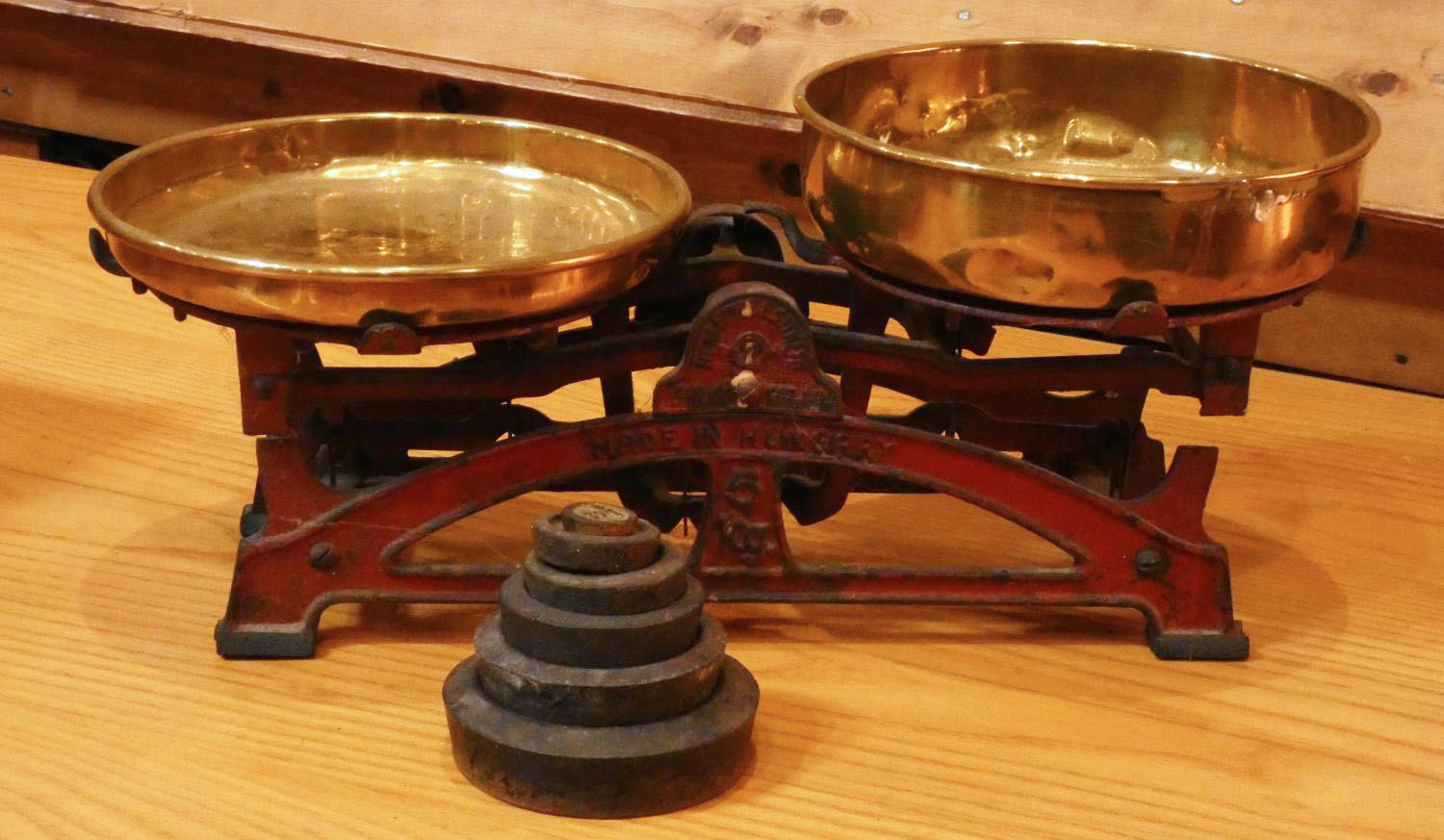 An early 20th Century set of cast metal & brass scales - stamped 'Made In Hungary' complete with a