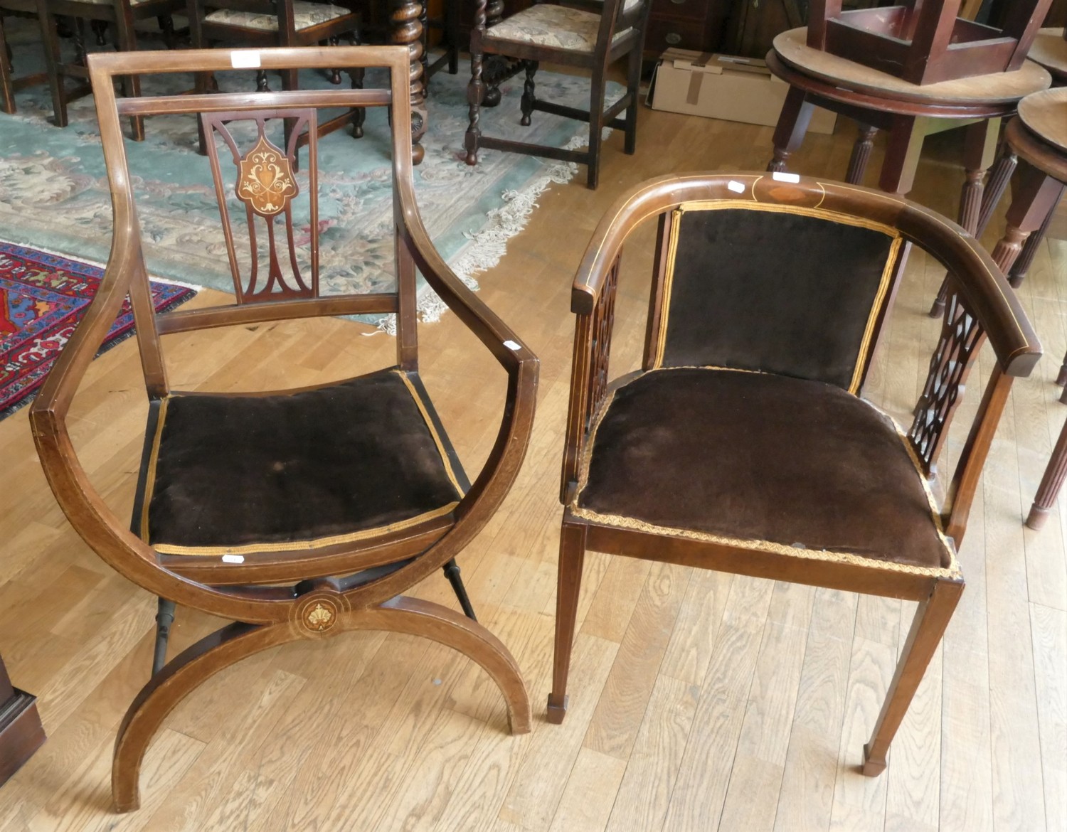 An Edwardian tub chair in mahogany with inlay to the legs and arms, shaped supports to the arms