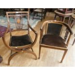 An Edwardian tub chair in mahogany with inlay to the legs and arms, shaped supports to the arms