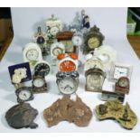 A collection of clocks to include, a Jerger alarm clock, a Juliana quartz mantel clock, a Masons