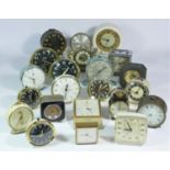 A collection of clocks to include, a Swiza 8 day alarm clock, a Metamec wall clock, a Splendex