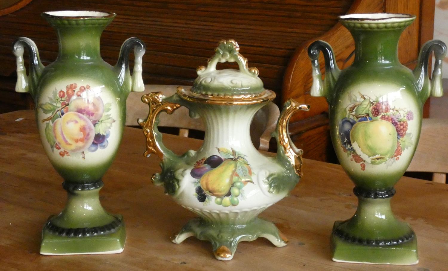 A three piece 'Green Fruit' ceramic set to include, a pair of vases & a matching teapot. (3)