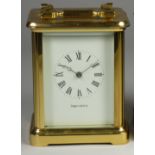 A brass carriage clock, the white enamel dial signed Mappin and Webb Ltd, Roman numerals, the 11