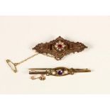 An Edwardian 9ct rose gold panel brooch, Birmingham 1905, set with a red paste and half pearl