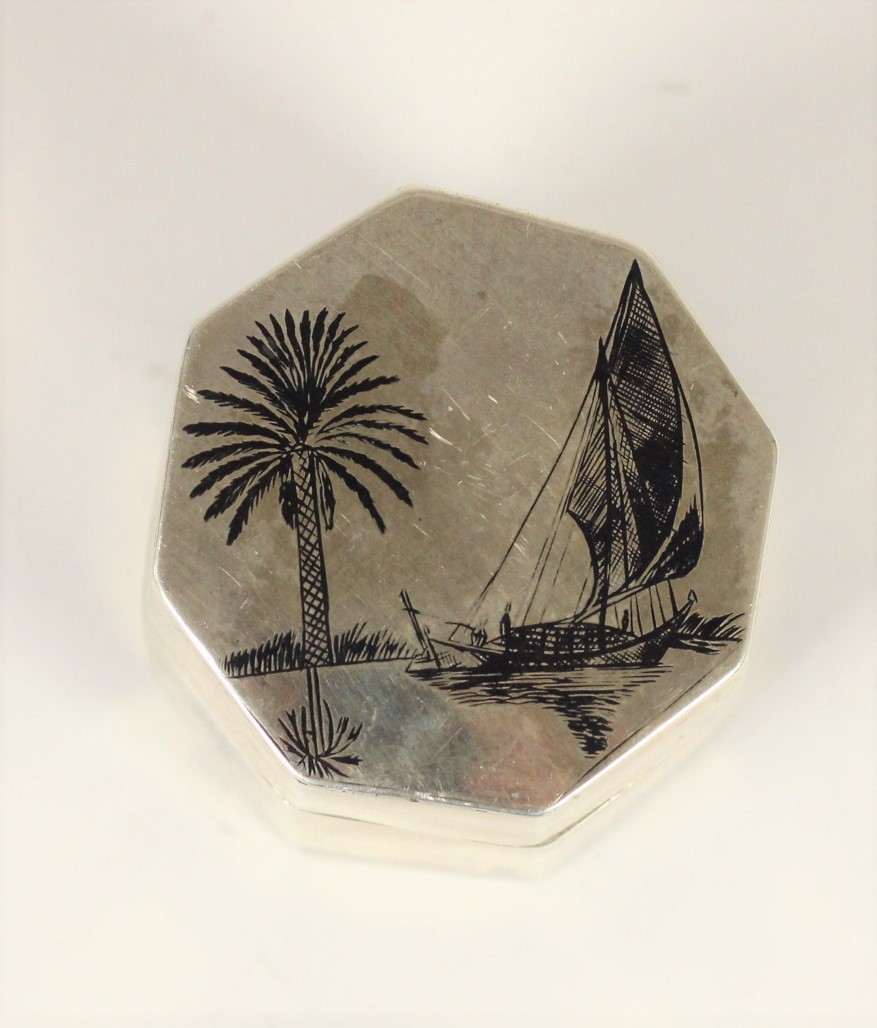 An Egyptian silver and niello octagonal box, with camel and boat decoration, 5cm high, 2oz - Image 2 of 3