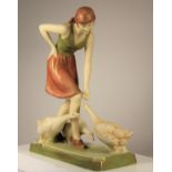 A Royal Dux figure of a woman feeding geese, pink triangle mark and stamped 3287 to base, 27 x 23 cm