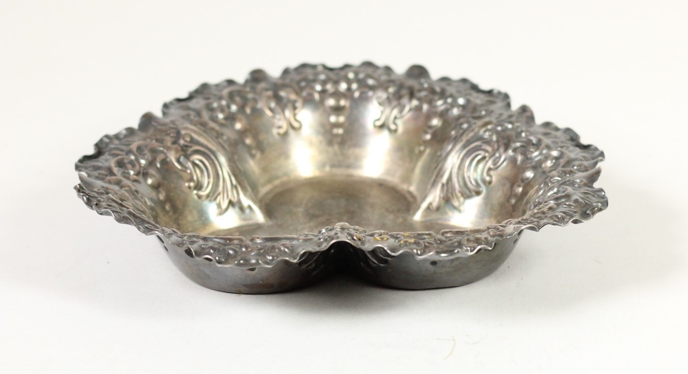 A Victorian silver bon bon dish, Sheffield 1900, of trefoil form with embossed decoration, 12cm,