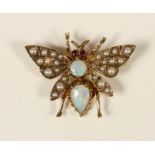 A 9ct gold opal, ruby and half pearl Victorian style butterfly brooch, London 198, 27 x 20mm, 3.2gm.