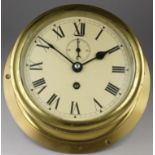 An F.W. Elliott Ltd of Croydon brass bulkhead clock, with twist off bezel, the 5 1/2" dial with