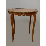 A French kingwood and ormolu oval side table, with quarter veneered top, applied mounts to border