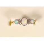 An Edwardian 18ct gold, opal and diamond threes stone ring, stamped 18ct, numbered 6851,