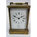 A French 19th century alarm carriage clock, the white enamel dial with subsidiary alarm dial, the