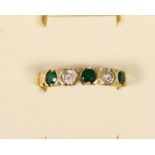 A French 14ct gold emerald and white stone five stone ring, set with brilliant cut stones, bearing