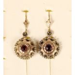 A Victorian pair of 10C cased garnet ear rings, diameter 14mm.