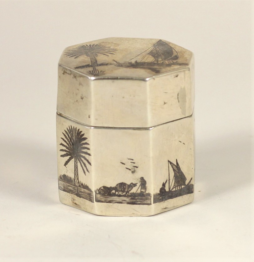 An Egyptian silver and niello octagonal box, with camel and boat decoration, 5cm high, 2oz