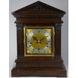 A Winterhalder & Hofmeier oak musical repeating bracket clock, with a silvered chapter ring and gilt