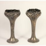 An Edwardian Art Nouveau silver pair of flower vases, Birmingham 1903, with embossed and chased