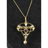 An Edwardian almandine garnet and half pearl brooch/pendant, stamped 9ct, collet set with mixed