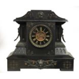 A Victorian slate mantel clock, the architectural case with gilt highlights, the dial with visible