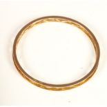 A 9ct rose gold slave bangle, stamped PPLd and 9ct, with crossover motif, internal diameter 60mm,