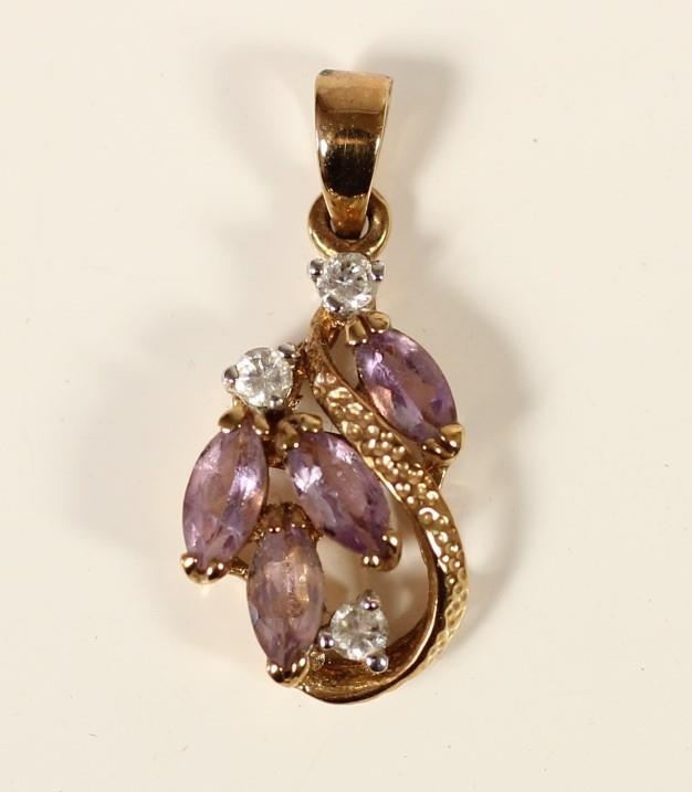 An 18K gold amethyst and diamond scroll pendant, claw set with brilliant and navette cut stones,