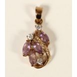 An 18K gold amethyst and diamond scroll pendant, claw set with brilliant and navette cut stones,