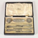 A silver manicure set, Birmingham 1925/6, with engine turned decoration, lacking scissors and two