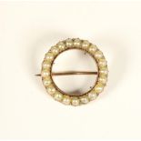 A Victorian rose gold hoop brooch, set with half pearls, diameter 23mm, 4gm
