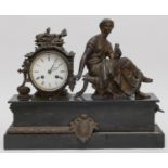 An Victorian onyx mantle clock, with a spelter figure of a lady reading, 34 x 42cm.