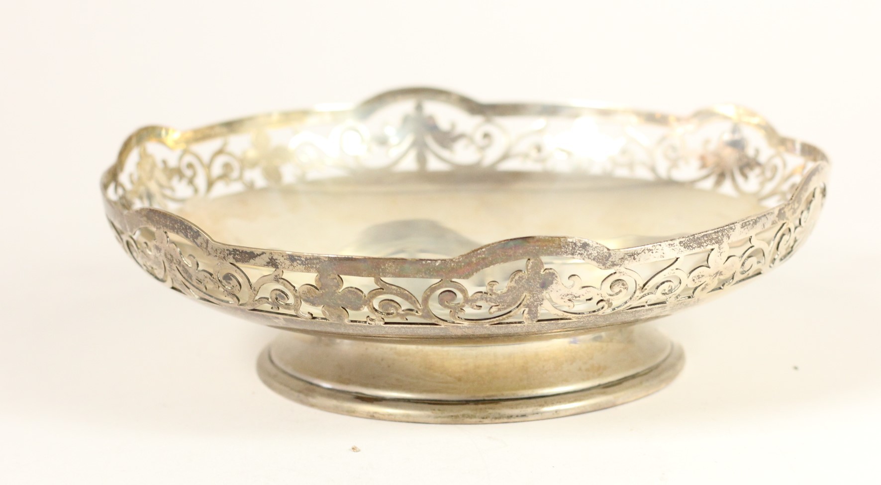 A silver pierced bowl, Sheffield 1944, raised on a pedestal foot, 16.5cm, 7.5oz. Presentation