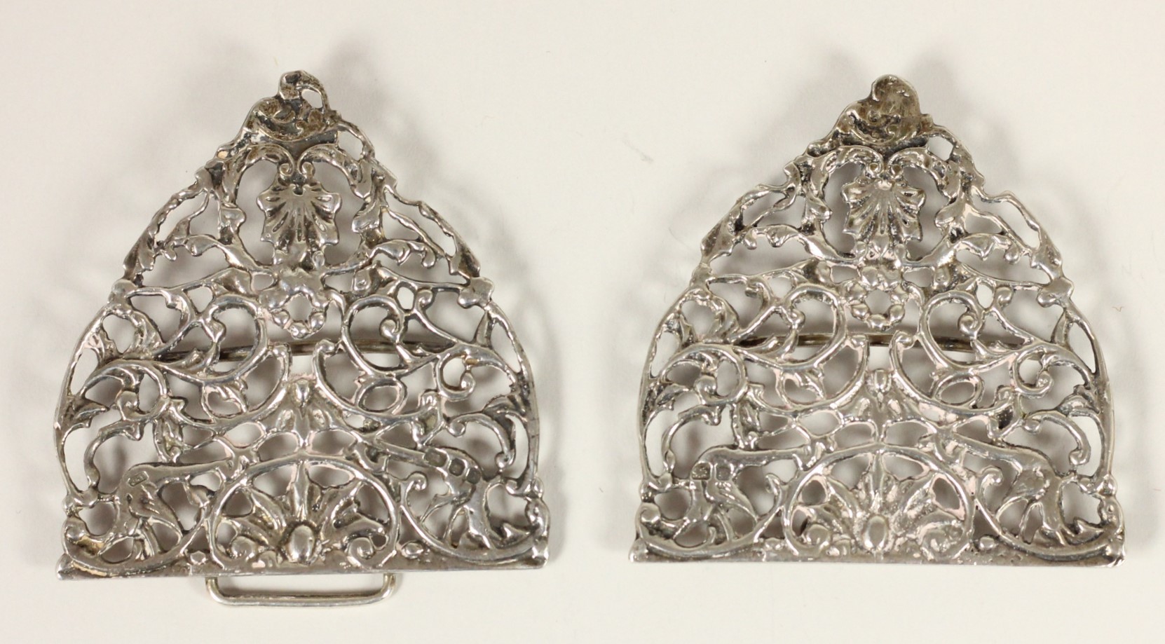 A cast silver nurses buckle, London 1989, with bird and floral decoration, 13.5 x 6.5cm, 2oz.