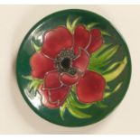 A Moorcroft plate, cobalt blue and green glaze, with red poppy flower detail, signed and dated