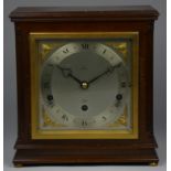 An Elliot, London 8-day lever Westminster and Whittington mahogany mantle clock, the silvered dial