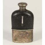 A Victorian silver and glass hip flask, London 1874, with screw cap to the leather covered glass