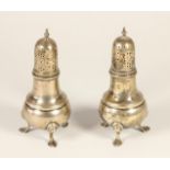 A silver pair of castors, London 1946, of baluster form, raised on three pad feet, 13.5cm, 7.5oz.