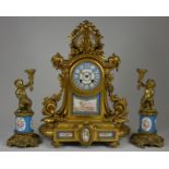 A 19th century French ormolu and porcelain mantel clock garniture, mounted with Sevres style