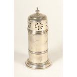 A silver sugar castor, Birmingham 1912, of plain form with waist band, pull off cover, vase