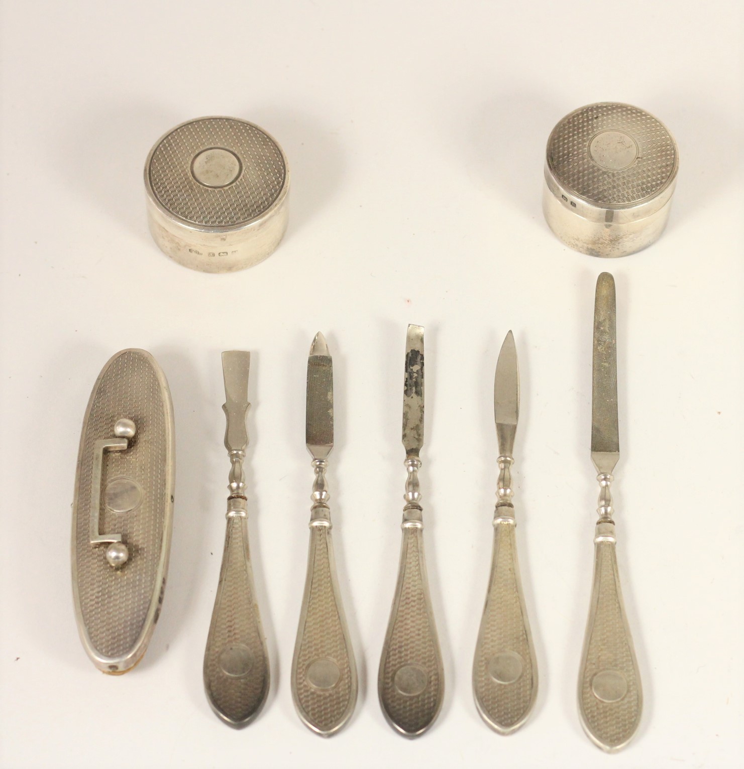 A silver manicure set, Birmingham 1925/6, with engine turned decoration, lacking scissors and two - Image 3 of 10