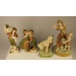 Four Royal Dux figures to include, a lamb, a boy holding a basket of puppies, a couple kissing and a