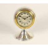 A silver boudoir clock, Birmingham 1922, the ball shape clock raised on a pedestal, 11cm, loaded