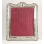 A silver mounted photograph frame, London 1997, with embossed gadrooned border, 33 x 28cm overall.