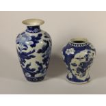 A Kang Si earthenware blue and white baluster vase, 4 character mark, decorated with two panels of