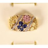 An 18ct gold blue, yellow and pink sapphire and diamond ring, by AP, Birmingham, date letter worn,