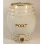 An early 20th century pottery PORT dispenser in the shape of a barrel, no lid or tap