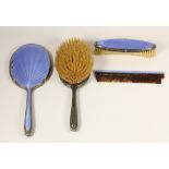 A silver and blue guilloche enamel four piece dressing table set, Birmingham 1936, mirror, two