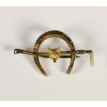 A Victorian 15ct two colour gold equestrian brooch, stamped HG&S, 15ct, fox head on a riding crop on