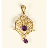 A Victorian 15ct gold, amethyst and half pearl pendant, engraved 15ct, c.1890, of openwork scroll