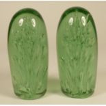 Two Victorian green glass dumps, with bubble decoration, 15 cm